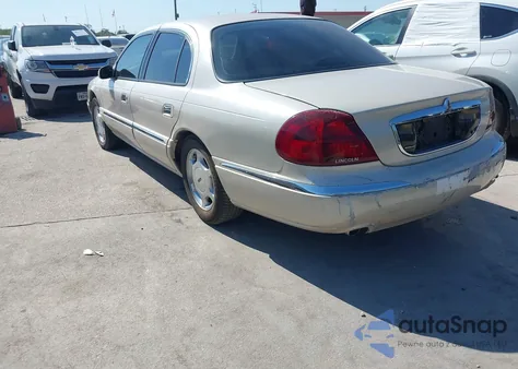 2000 Lincoln Continental из США, поврежденный, VIN 1LNHM97V8YY763843